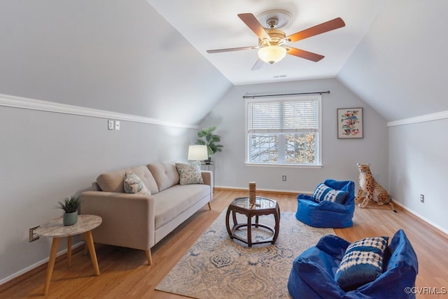 living room featuring light wood-type flooring, ceiling fan, and vaulted ceiling