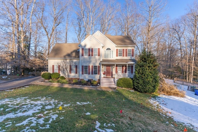 view of front of house featuring a porch and a lawn