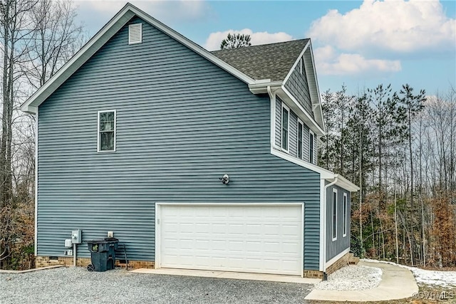 view of side of property with a garage