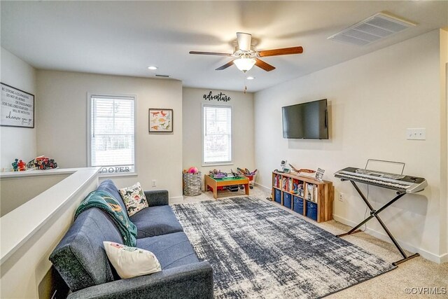 playroom featuring ceiling fan and carpet flooring