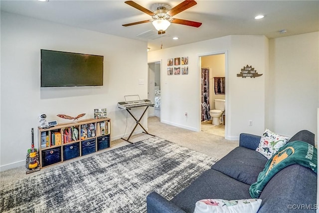 carpeted living room featuring ceiling fan