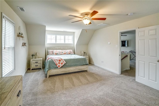 bedroom with ceiling fan and light carpet