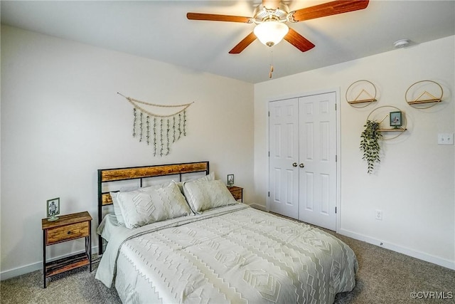 carpeted bedroom with ceiling fan and a closet