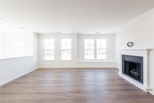 unfurnished living room featuring light hardwood / wood-style floors