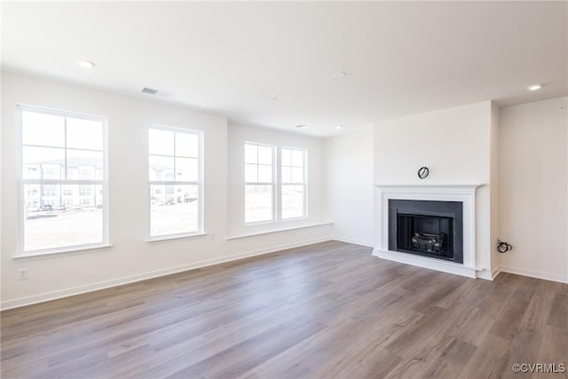 unfurnished living room with light hardwood / wood-style flooring