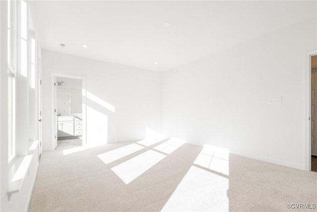 empty room featuring light colored carpet