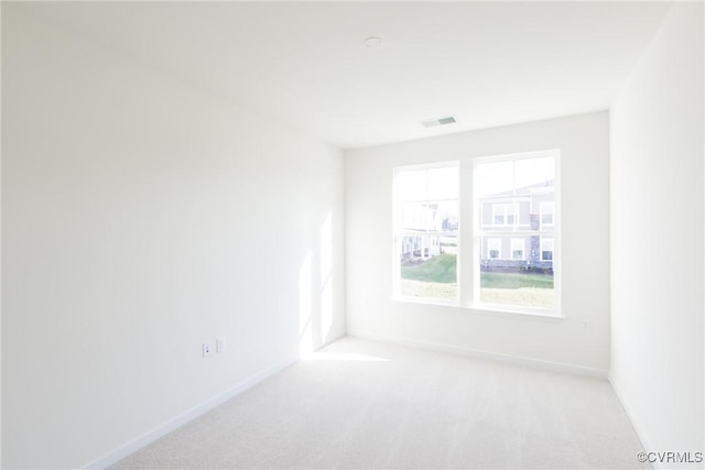 empty room with light colored carpet