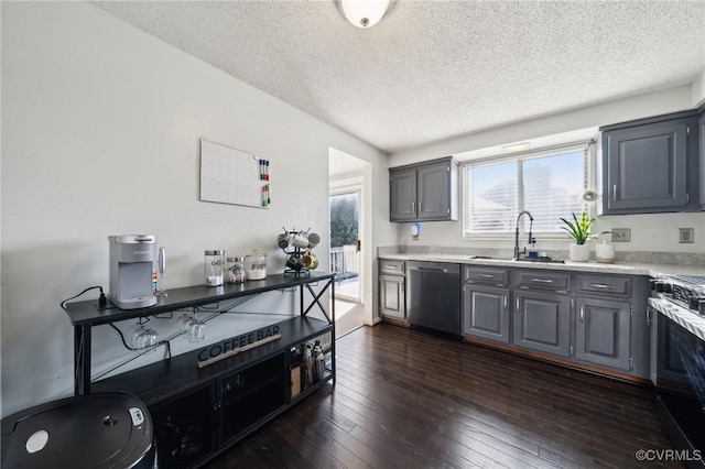 kitchen with sink, a textured ceiling, dishwasher, stove, and gray cabinets