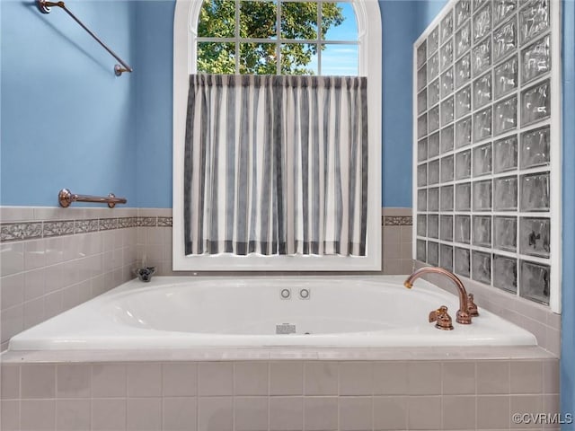 bathroom with tiled bath