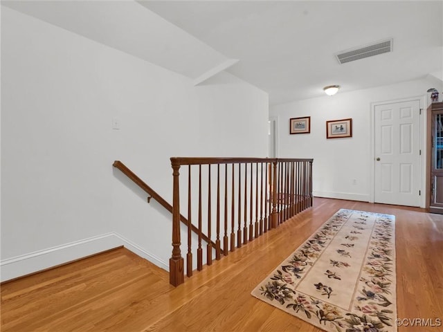 hallway with wood-type flooring