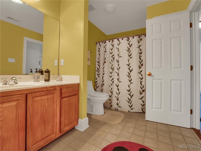 bathroom featuring walk in shower, vanity, and toilet