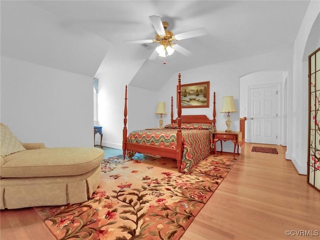 bedroom with lofted ceiling, wood-type flooring, and ceiling fan