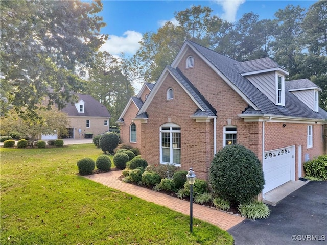 view of side of home featuring a yard and a garage