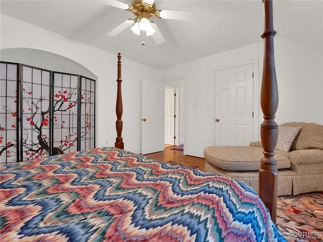 bedroom with wood-type flooring and ceiling fan