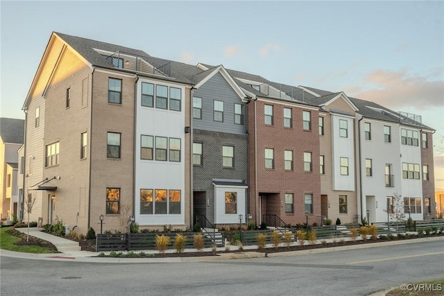 view of outdoor building at dusk