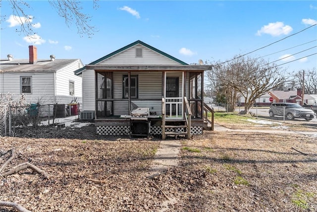 view of front of property with a porch and central AC unit