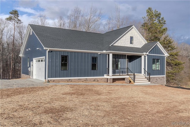 view of front facade with a porch and a garage