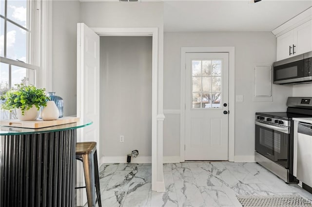 kitchen with stainless steel appliances and white cabinets