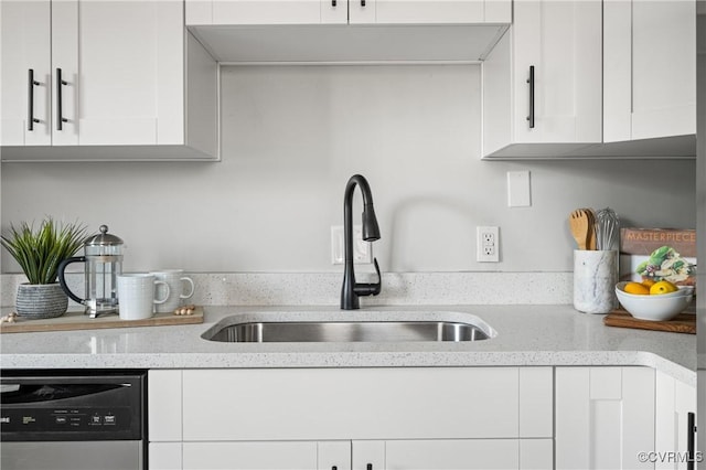 kitchen featuring sink, white cabinets, and stainless steel dishwasher