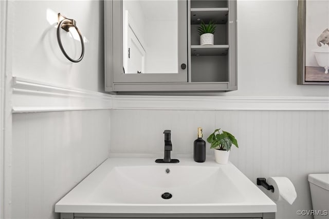 bathroom with vanity and toilet