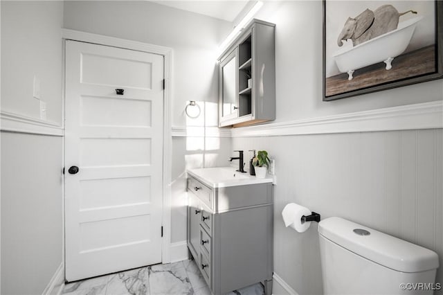 bathroom with toilet and vanity