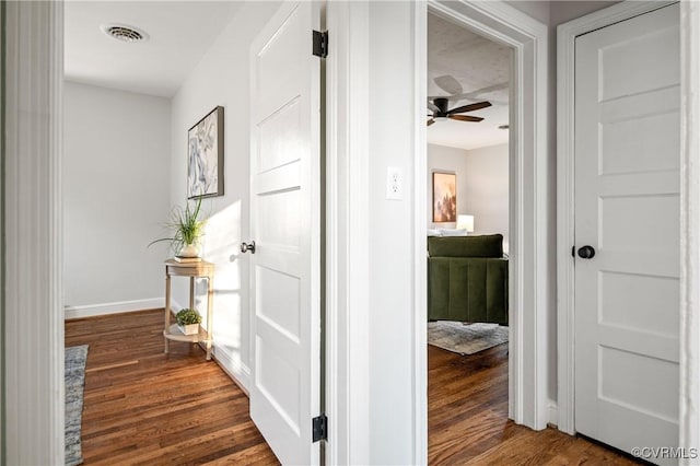 corridor featuring dark wood-type flooring