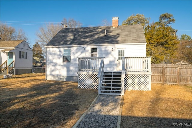 back of property with a wooden deck