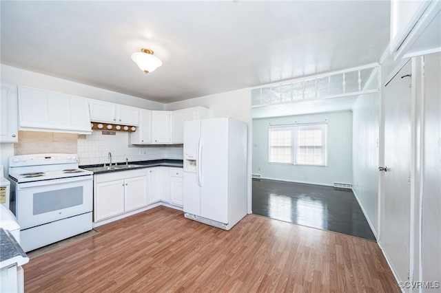 kitchen featuring sink, white appliances, white cabinets, decorative backsplash, and light wood-type flooring