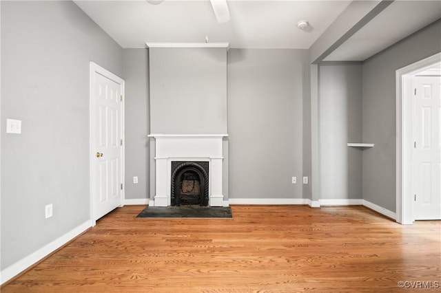 unfurnished living room featuring hardwood / wood-style flooring