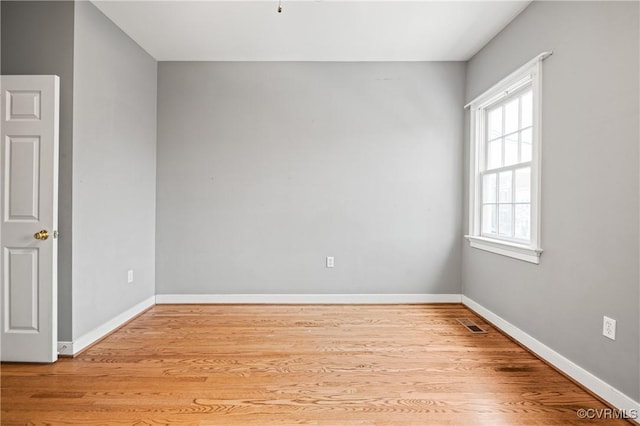 unfurnished room with light hardwood / wood-style flooring