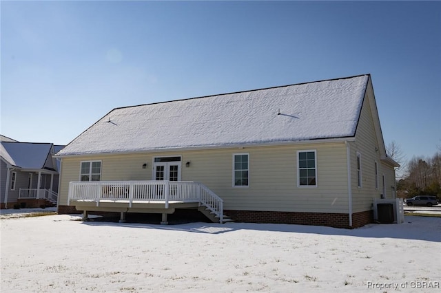 rear view of house with french doors, a deck, and central air condition unit