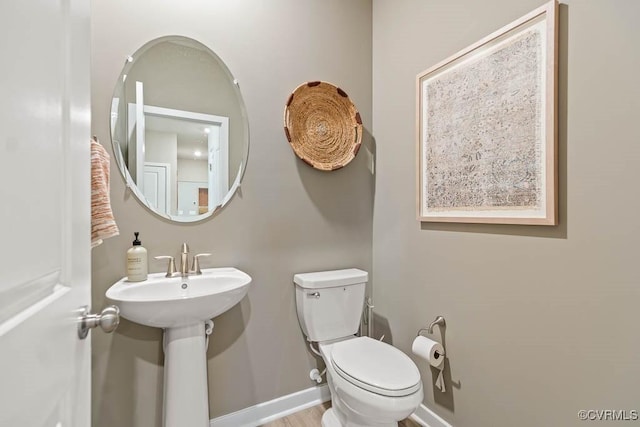 bathroom with toilet and sink