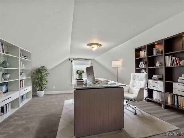 home office with lofted ceiling