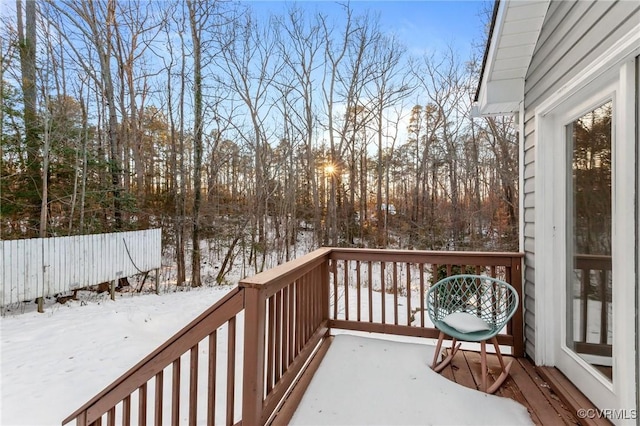 view of snow covered deck