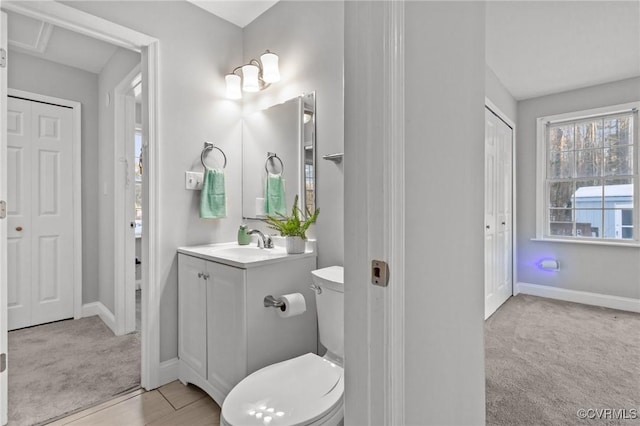 bathroom with toilet and vanity