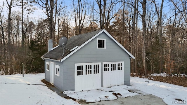 view of snow covered garage