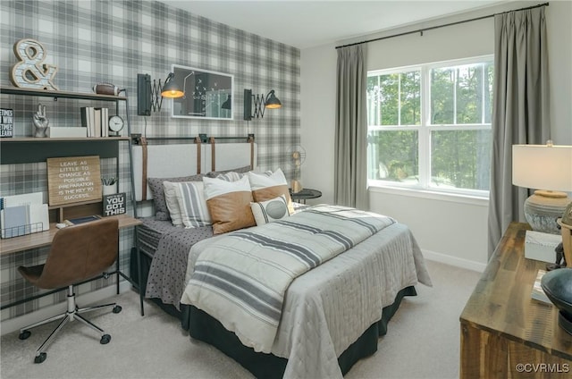 bedroom with multiple windows and carpet