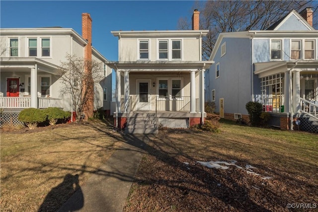 view of front of house featuring covered porch and a front lawn