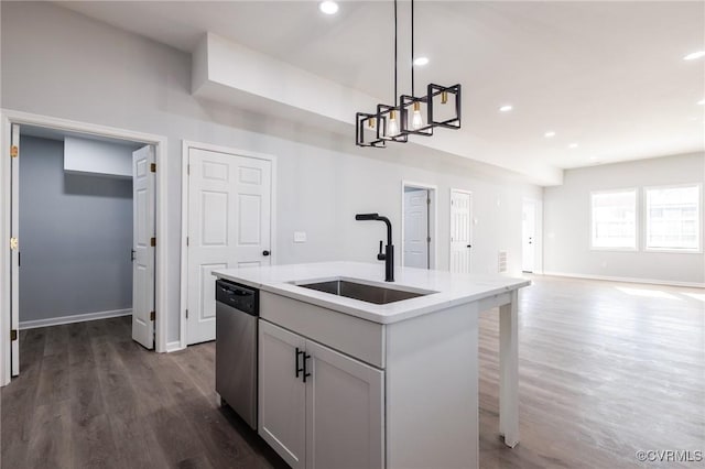 kitchen featuring recessed lighting, dark wood-style flooring, a sink, hanging light fixtures, and stainless steel dishwasher