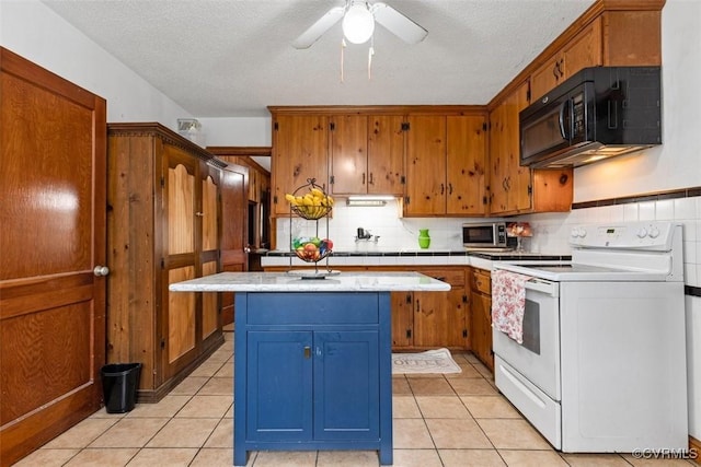 kitchen with a kitchen island, electric range, ceiling fan, and a textured ceiling