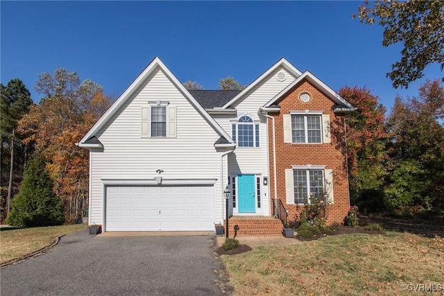 view of front property with a front lawn and a garage