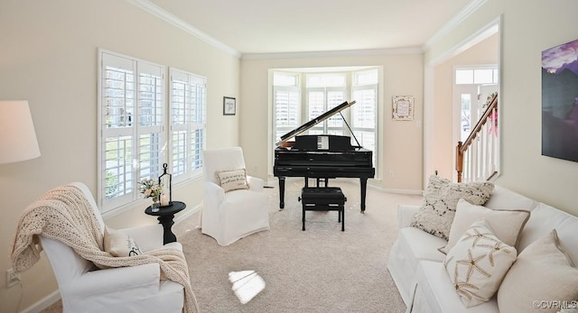 sitting room with ornamental molding, a healthy amount of sunlight, and light colored carpet