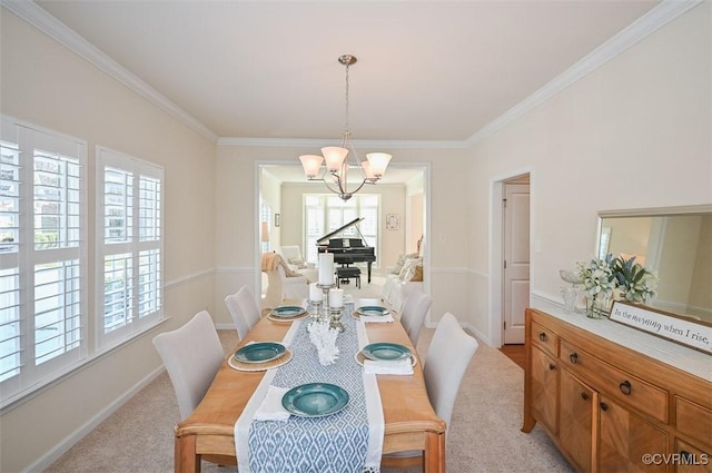 dining room featuring light carpet, an inviting chandelier, and crown molding