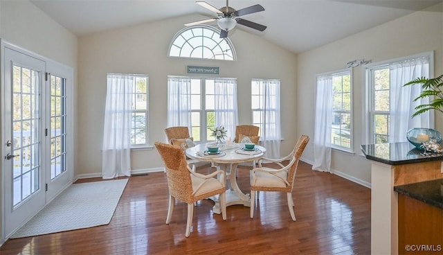 dining space featuring ceiling fan, plenty of natural light, dark hardwood / wood-style flooring, and lofted ceiling