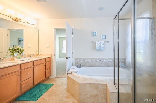 bathroom featuring vanity, tile patterned flooring, and plus walk in shower