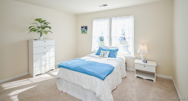 bedroom with light carpet