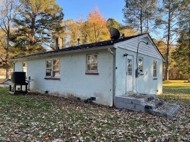 back of property with central air condition unit