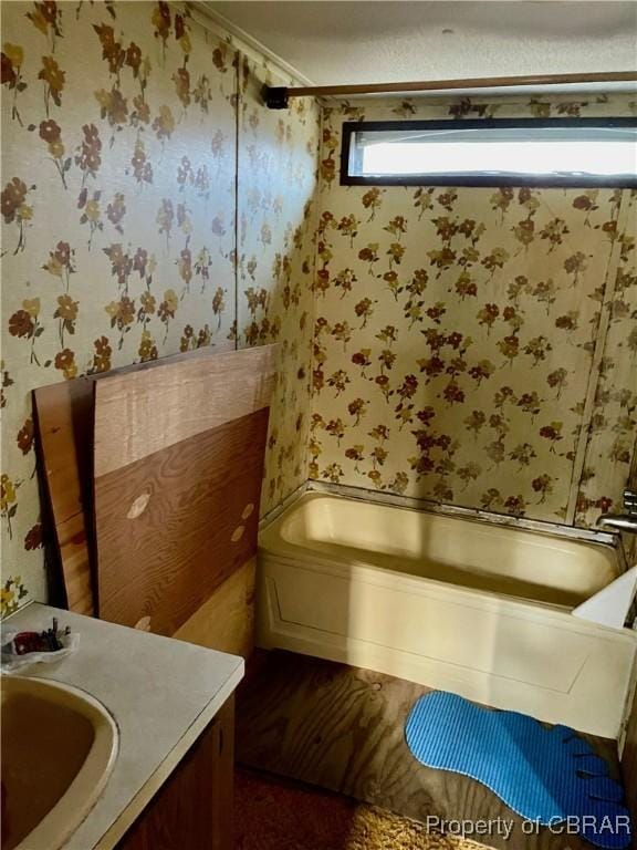 bathroom featuring crown molding and vanity