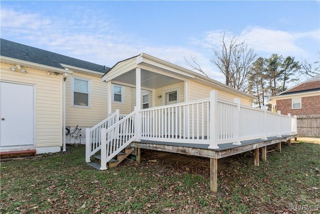 rear view of house with a wooden deck