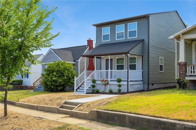 view of front of property featuring a front yard and covered porch